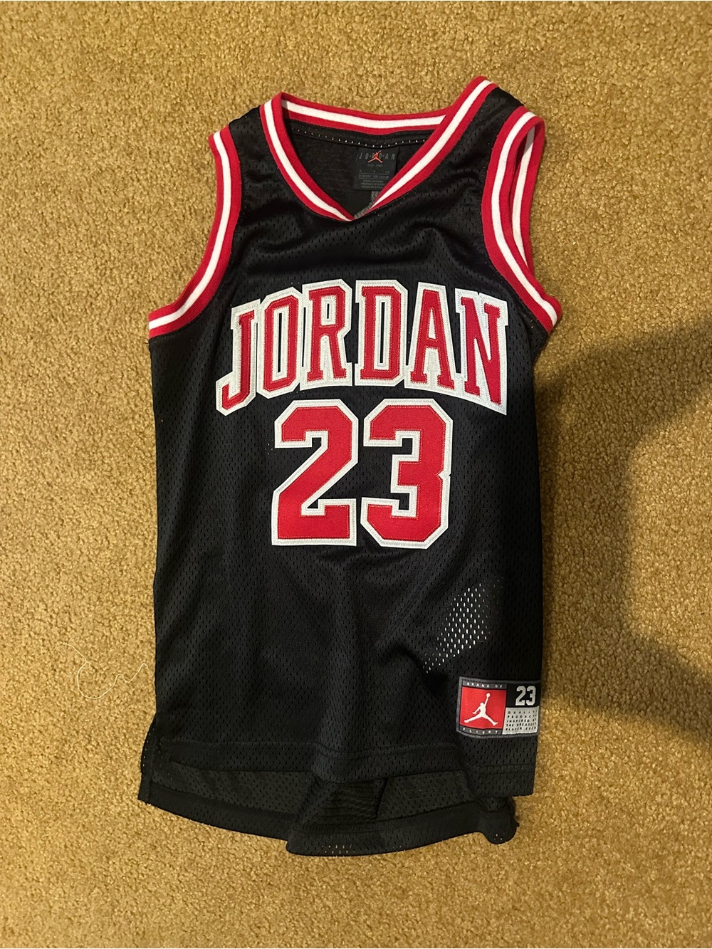 Jordan Black Jersey with Red & White Trim youth small (age 8-10)